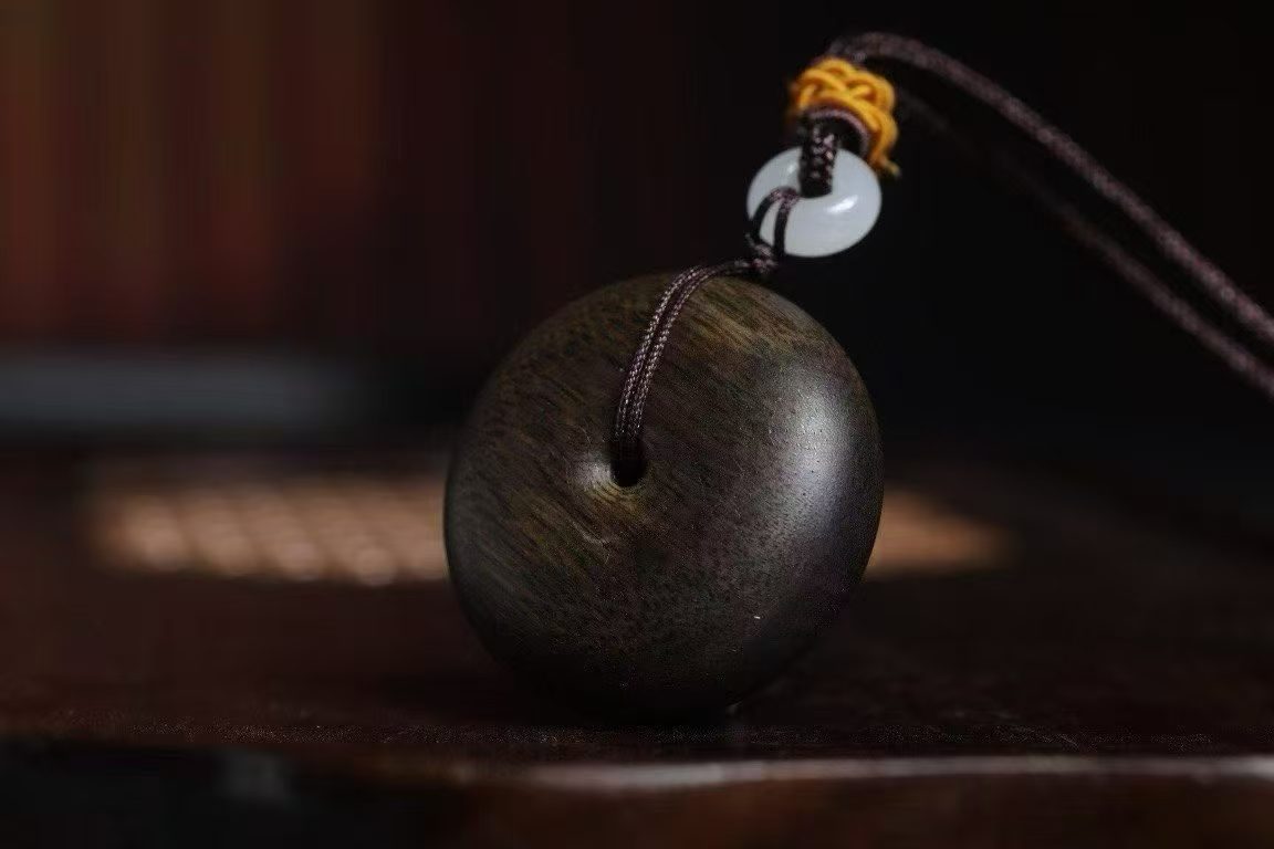 Brunei agarwood pendant lying flat